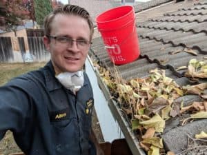 honest lee handyman performing gutter cleaning in sacramento