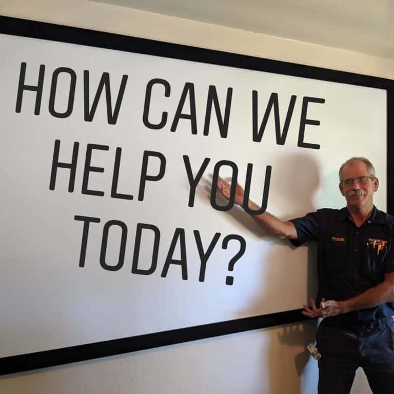 frank, handyman at honest lee handyman services in sacramento, in front of white board